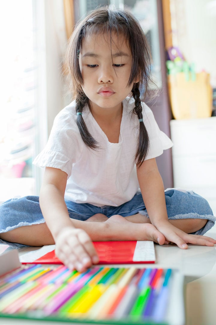 Child learning at home in the living room