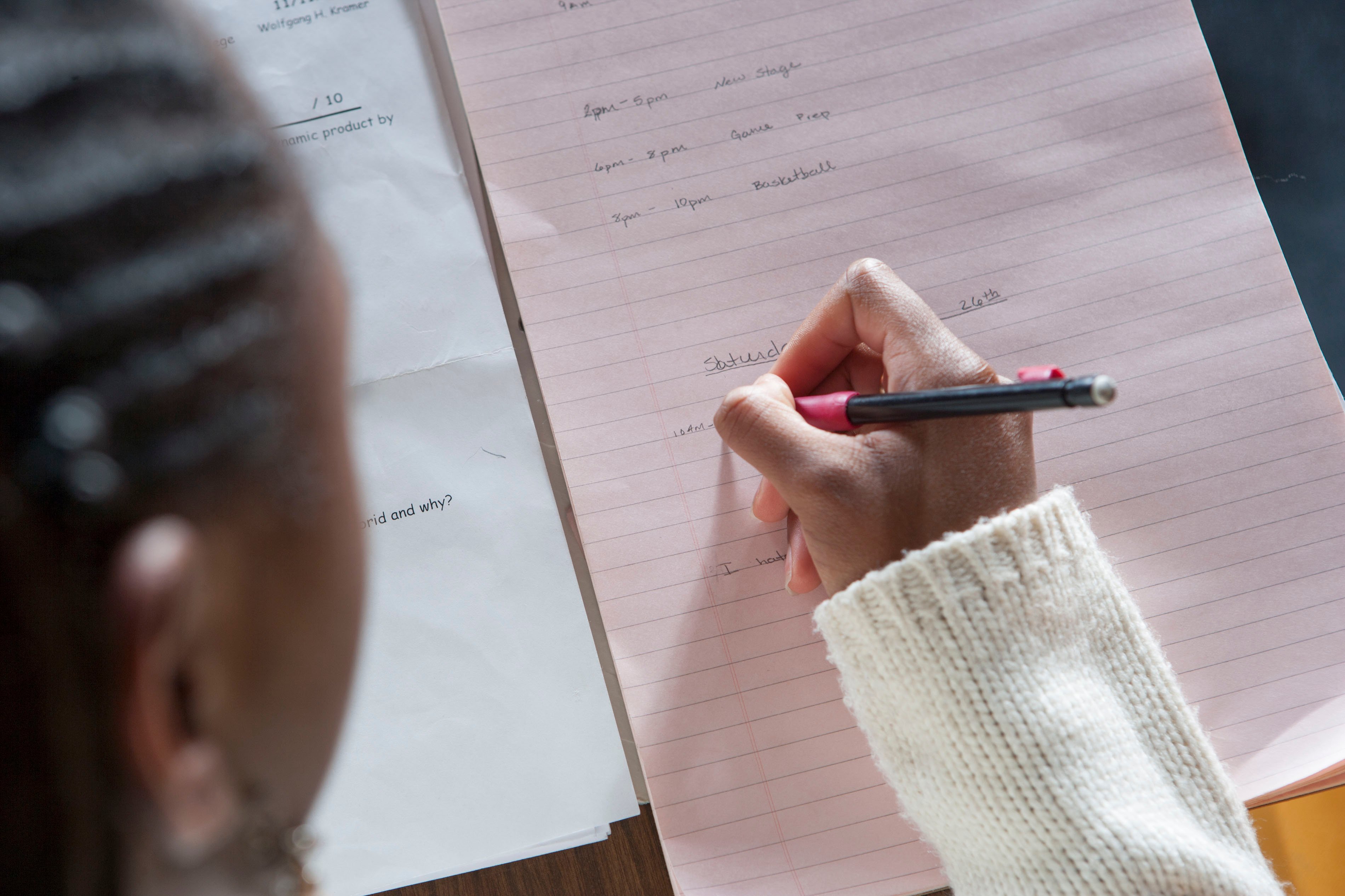 student-taking-notes-in-classroom